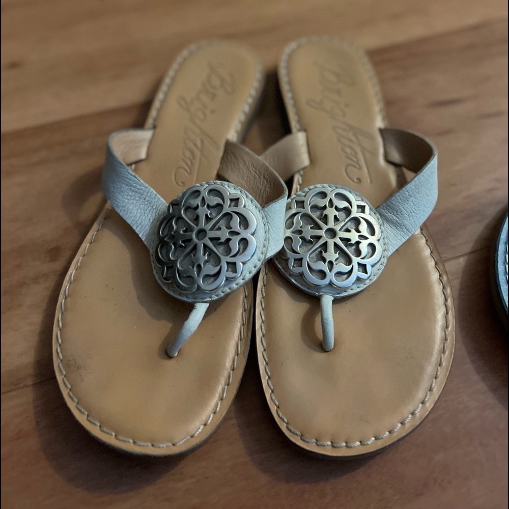 Brighton flat white leather sandals size 6 with silver Brighton motif
